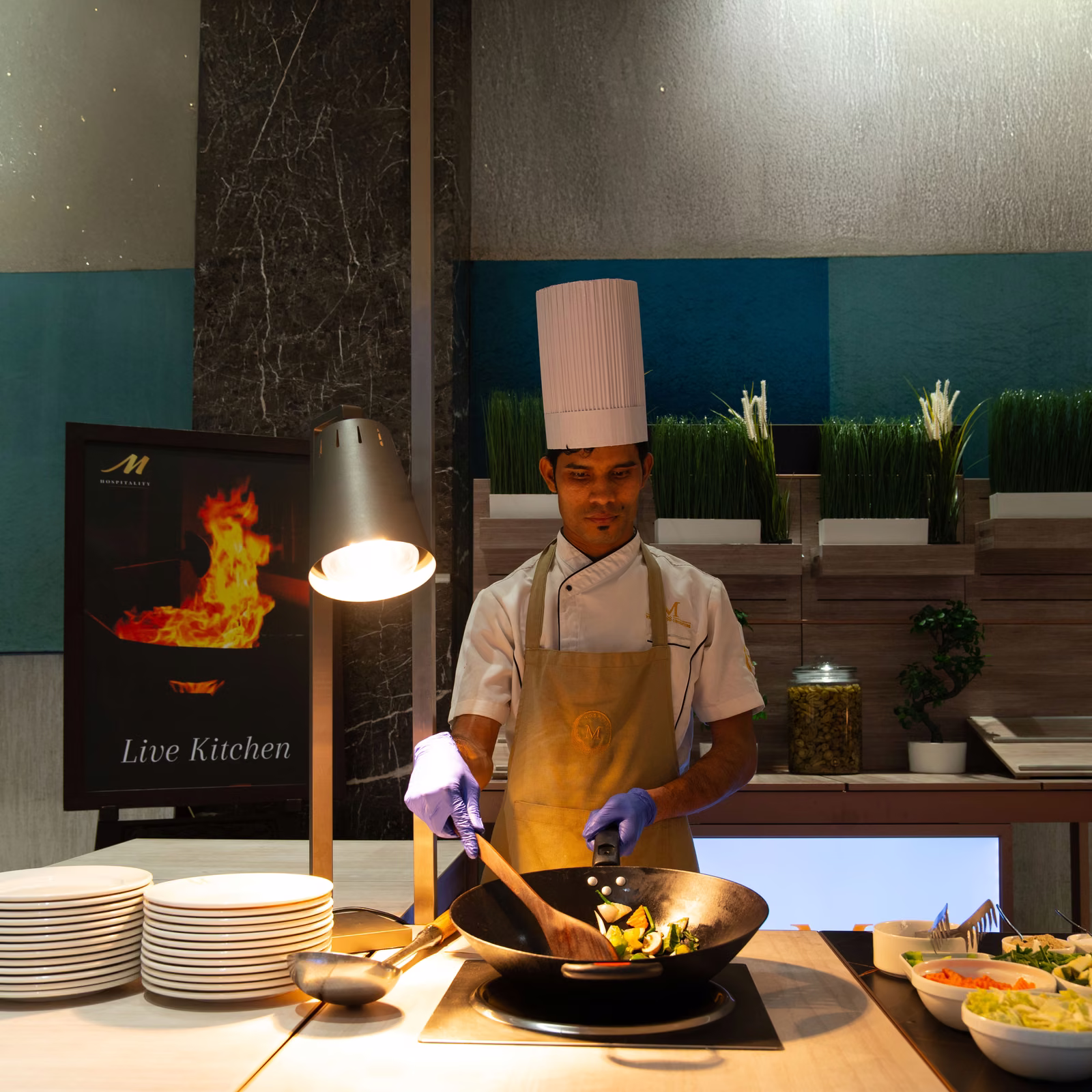 Chef at a live wok station